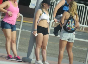 Couple of babes standing around in shorts
