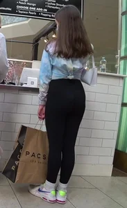 Hot girl in black tights at the food court