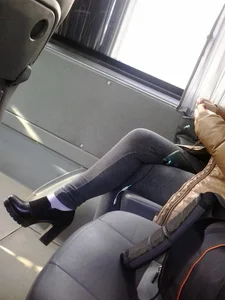 Nice crossed legs in tight jeans and high heels in public transport creepshot