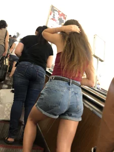 Great Hot Butt in Denim Shorts And Tattooed Legs Subway Escalator Creepshots - Candid Girl Touching Her Hair