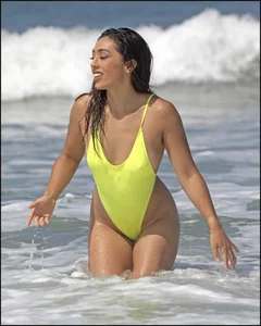 Sexy ass beach babe in a yellow thong swimsuit