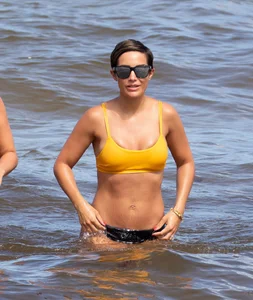 Frankie Bridge nip slips in a bikini on the beach