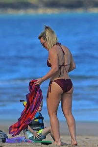 Hilary Duff in maroon bikini on the beach with a big booty