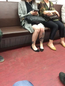 Tattooed Legs in Flats Subway Train Candid