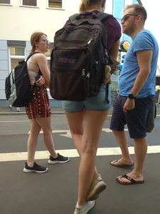 Girl with Skinny Hot Legs in Denim Mini Shorts with Rucksack City Candid