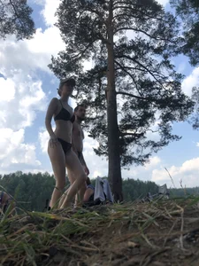 Skinny and Tall Girl in Swimsuit Walking in a Wood