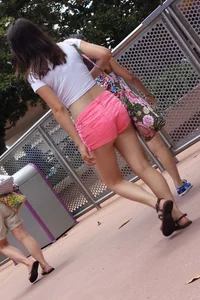 Sexy girl in pink shorts showing some cheek