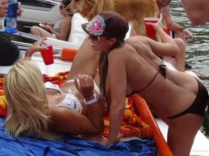 Party girls looking sexy out on boats in bikinis
