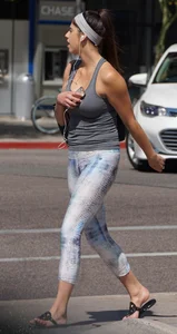 Flat ass brunette walking in leggings with big boobs