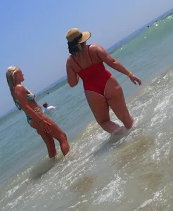 Thick big booty girl in a swimsuit with blonde friend in a bikini