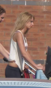 Sexy and slim blonde in see thru leggings with thong