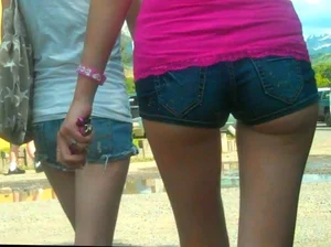Skinny babe in denim shorts with a nice gap showing ass cheeks