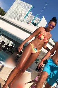 Skinny and sexy tanned bikini girl out at the pool