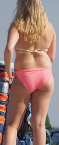 Thick blonde bikini babe on the beach