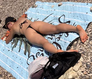 Large collection of hot beach girls lying on the beach and bending over