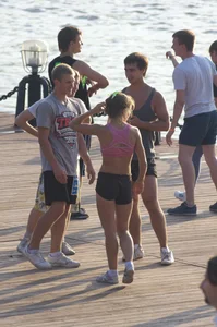 Fit Cheerleader Girl in a Pink Top and Spandex Shorts