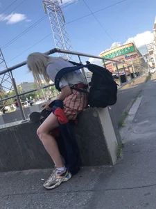 Blonde Girl Busy with Her Smartphone on the Street Candid Gallery