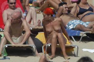 Topless girls on a beach in Barcelona