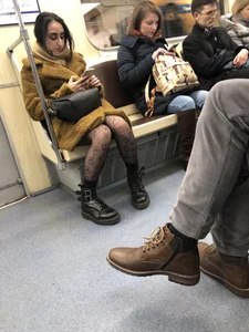 Girl with Nice Legs in Dark Pantyhose with Hearts Ornament in the Subway Train Candid Pics