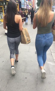 Sexy girl walking in grey patterned leggings with friend in tight jeans