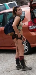 Girl in a Top and Mini Shorts With Fit Muscular Legs Hot Creepshot