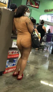 Latina with hard nipples and a big booty in tight spandex shorts outfit