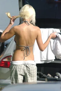 Blonde babe changing into and out of bikini and shows her tits