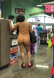 Latina with hard nipples and a big booty in tight spandex shorts outfit