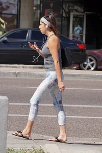 Flat ass brunette walking in leggings with big boobs