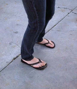 Feet in Slippers Street Closeup Photo