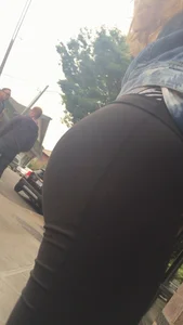 Girl with a nice ass in leggings walking down the street