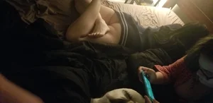 Unsuspecting girls lying on stomach