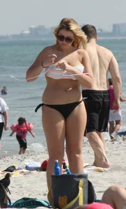 Big boobed thick blonde on the beach in a bikini