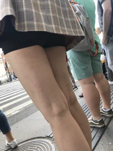 Closeups of a gorgeous girl wearing spandex mini shorts crossing the street