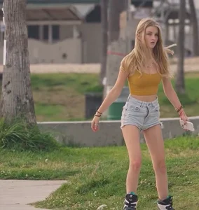 Couple of hot and cute girls in mini-shorts on rollerblades park creepshots
