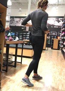 Shoe store employee with a sexy bubble butt in leggings