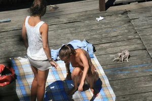 Two teens stripping and going topless to tan