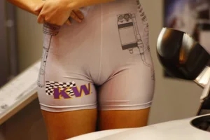 Car show models in spandex short suits with cleavage and camel toe