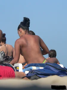 Hot ass topless beach girl with great tits lets her little brother oil up her ass in thong bikini