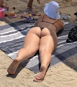 Large collection of hot beach girls lying on the beach and bending over