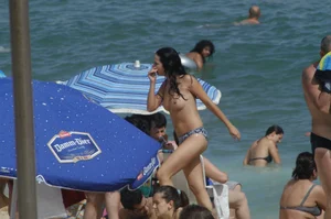 Topless girls on a beach in Barcelona