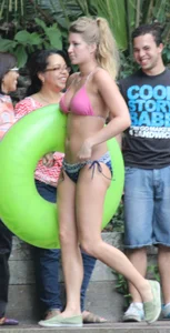 Blonde bikini girl at the pool in pink bikini top with amazing tits