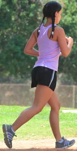 Hot brunette running in short shorts with vpl