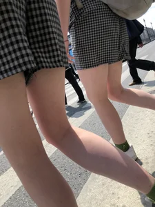 Two Teen Girls in Matching Shorts With Slim Legs on the Crosswalk Large Creepshots Gallery