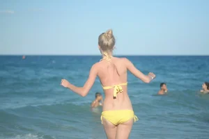 Skinny Teen on the Beach in Swimsuit