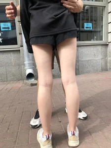 Skinny upshorts booty cheek and long slim legs closeups