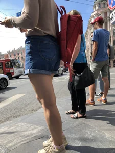Closeup of nice legs and booty in denim shorts on a crosswalk