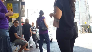 Sexy ass in leggings waiting for the bus
