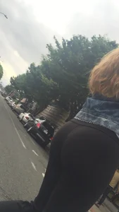 Girl with a nice ass in leggings walking down the street