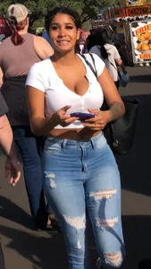 Huge tits in a low cut white top and tight jeans